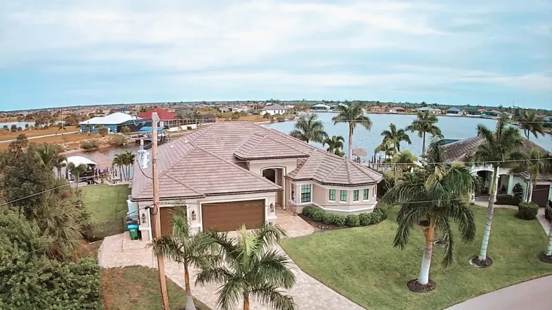 Aerial view of a tile roof on a waterfront home, Big River Roofing