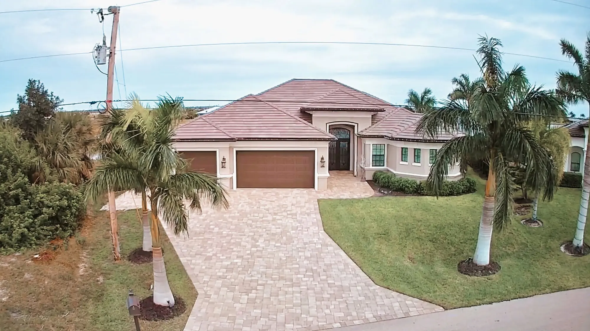 Tile roof on a single-story stucco home, residential roofing by Big River Roofing